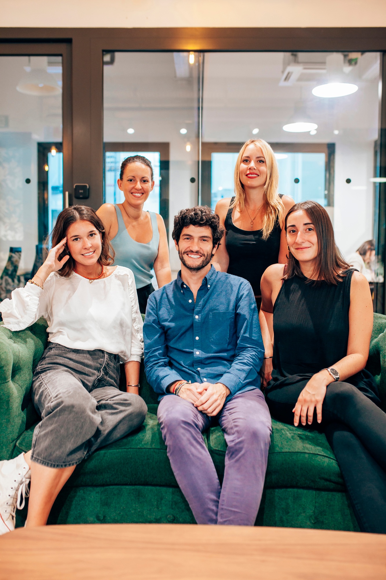 Successful young business team gathering in modern workspace
